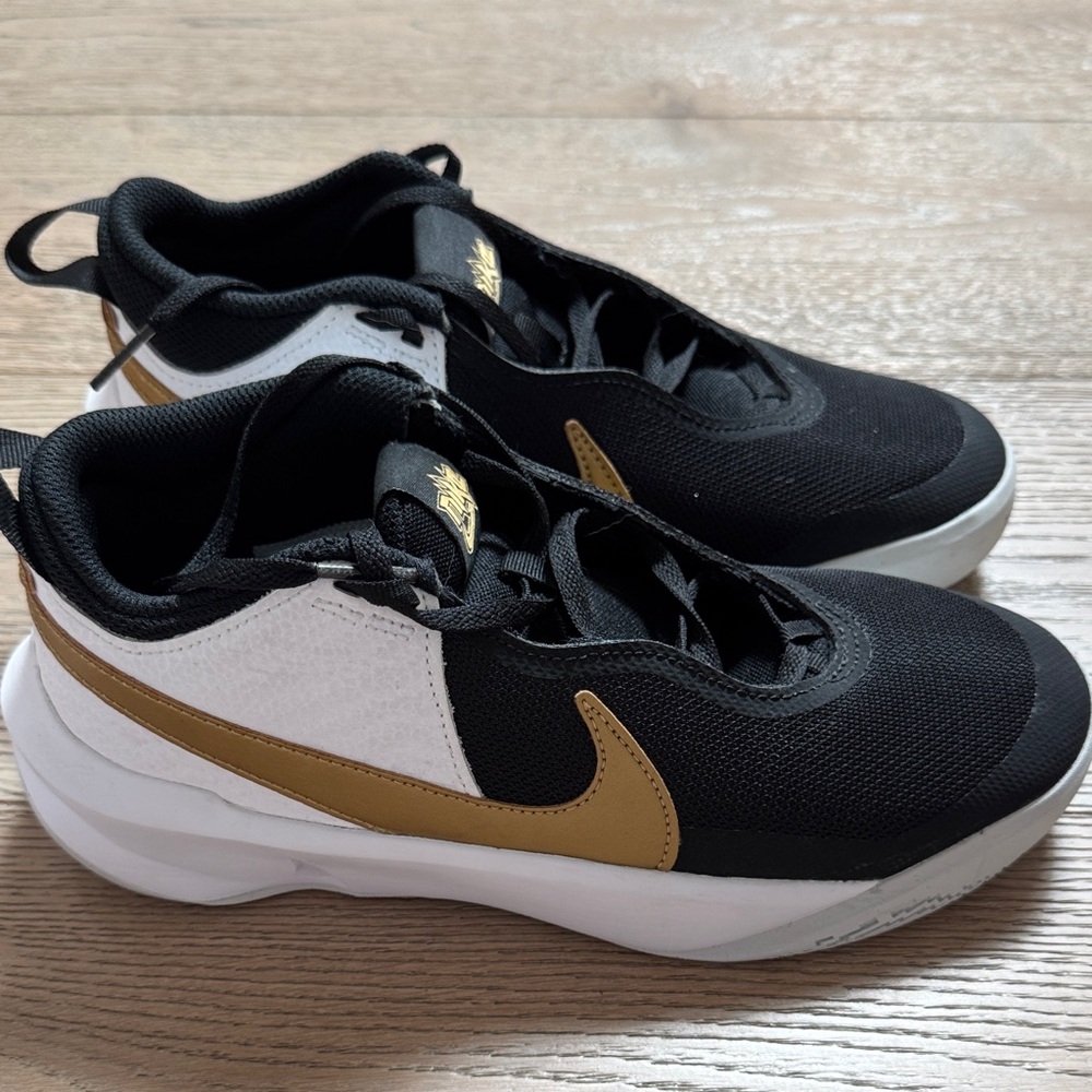 Nike Hustle Black and Gold Athletic Sneakers